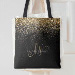 Bolso De Tela Purpurina dorado Glam Monograma Nombre<br><div class="desc">Purpurina Glam Gold Elegant Monogram Tote Bag. Personaliza fácilmente este diseño de bolsos de moda a la moda con un elegante purpurina brillante de oro sobre un fondo negro. El diseño incluye su monograma manuscrito con remolques de bonito y su nombre.</div>