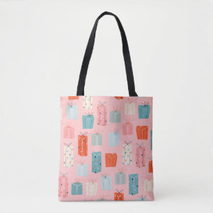 Bolso De Tela Regalos de Navidades coloridos sobre un fondo rosa