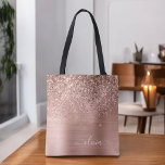 Bolso De Tela Rosa Dorado Glitter Monograma de Metal Bruñido<br><div class="desc">Bolsa de Libro de Monograma Elegante de Acero Inoxidable y Hoja Metálica con Rosa Dorado y Rosa Claro Falso Brillo y Glitter que Gotea. Esta Bolsa de Libro se puede personalizar para incluir su inicial y primer nombre y se puede regalar como regalo para Navidad, Cumpleaños de Sweet 16, Despedida...</div>