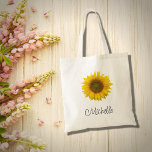 Bolso De Tela Rústico floral de girasol moderno<br><div class="desc">Bolsa de tetas floral moderna,  con una imagen rústica de flor de girasol amarillo. Con grabados en escritura negra,  puede personalizar el texto para hacer un gran accesorio personalizado. Perfecto para mantener tus objetos juntos cuando estás de viaje.</div>