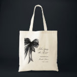 Bolso De Tela She’s Tying The Knot Black Bow Bridal Shower<br><div class="desc">Celebrate the bride-to-be with this She’s Tying The Knot Black Bow Bridal Shower Tote Bag, designed with a chic coquette-inspired black bow and elegant modern typography. Perfect for bridal showers, bachelorette celebrations, and wedding events, this stylish tote makes a thoughtful gift for the bride, bridesmaids, or guests. Ideal as a...</div>