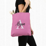 Bolso De Tela Stylish Pink Personalized Monogram Tote Bag<br><div class="desc">Stylish Pink Personalized Monogram Tote Bag featuring an elegant arrangement of name and monogram initial on a pretty pink background. The bag is easy to personalize by typing the name and initial of your choice into the online personalization template before ordering. The text automatically copies across to the other side...</div>