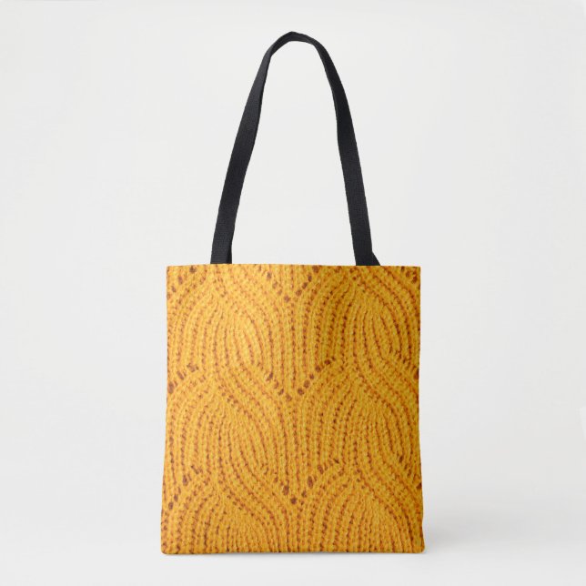 Bolso De Tela Suéter de punto naranja, fondo texturado. (Anverso)