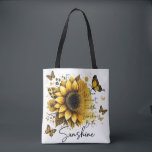 Bolso De Tela Sunshine Be the Sunshine |<br><div class="desc">This tote bag features a clean, modern design with a soft, uplifting aesthetic. The bag itself is white with sturdy black shoulder straps, creating a nice contrast that makes the artwork stand out. The front showcases a large, beautifully detailed sunflower in rich golden and amber tones, with layered petals and...</div>