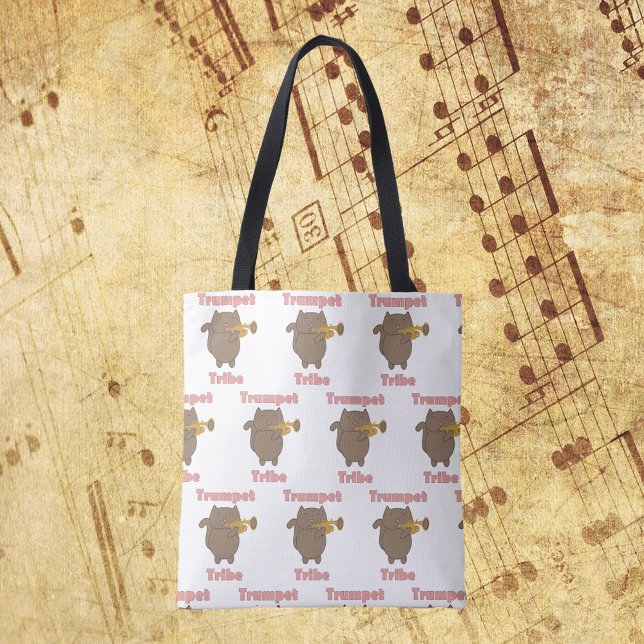 Bolso De Tela Trumpet Tribe Brown Cat Pattern (A tote bag with a pattern of a cat playing the trumpet and the words trumpet tribe in pink.)