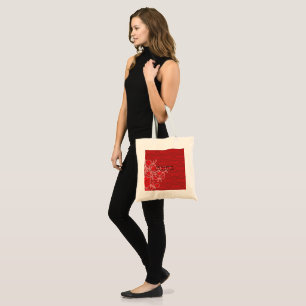 Bolso De Tela Un diseño intrincado de motivos rojos y marrones,