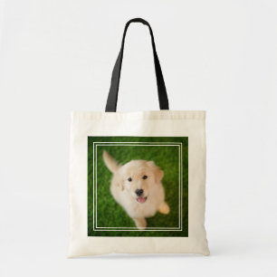 Bolso De Tela Una cachorro dorada en el césped