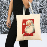 Bolso De Tela Vintage Christmas, Jolly Winking Santa Claus<br><div class="desc">Diseño de vacaciones de Navidades de ilustracion de época con un feliz y alegre Santa Claus usando un gorra y guiñando el ojo como si tuviera un secreto. Ho,  ho,  ho,  ¡Feliz Navidad!</div>