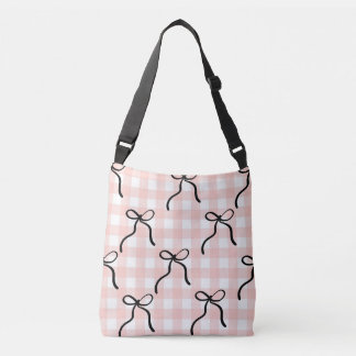 Bolso tote cruzado rosa con lazos negros