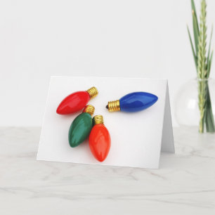 Bombillas de Navidad coloridas en blanco, carta de