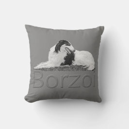 Borzoi en almohada del descanso
