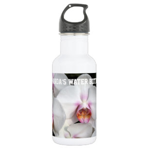 Botella De Agua Flor de orquídea blanca exótica. Fotografía floral