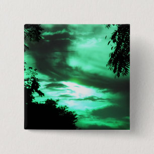 botón cielo verde nublado