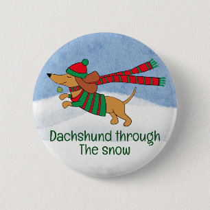 Botón de Navidad del Dachshund a través de la niev