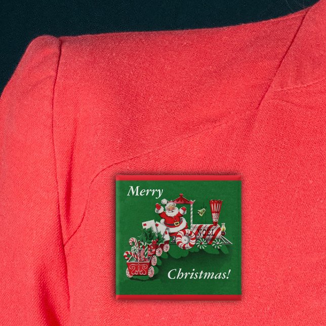 Botón de tren de Santa Navidades (Santa riding train peppermint candy wheels candy canes Merry Christmas green pin back button.)