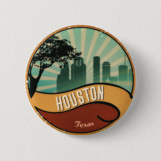 Botón retro del vintage del horizonte de la ciudad
