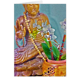 Buda con orquídeas blancas