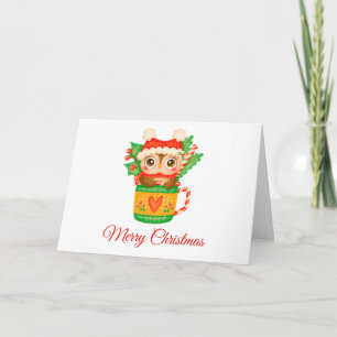 Búho bebé de Navidad en una taza de té con bastón 