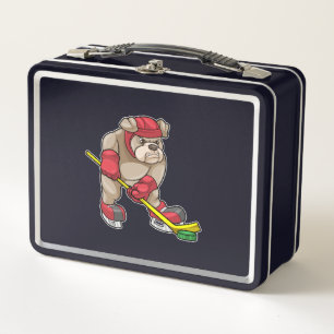 Bulldog en hockey sobre hielo con bastón de hockey
