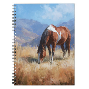 Caballo de rayas en el cuaderno de las montañas