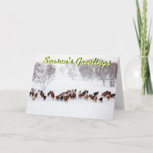 Caballos en la tarjeta de Navidad de la nieve