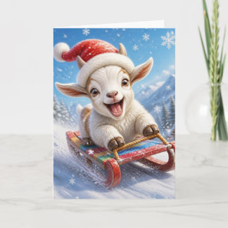 Cabra divertida en trineo en la nieve en Navidad