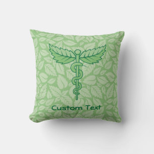 Caduceo con Cojín decorativo de fondo de hojas
