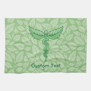 Caduceo con toalla de fondo de hojas