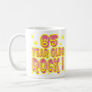 Café ¡85 años de la roca! Taza (rosada)