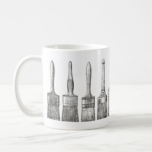 Café Cepillos del barniz de los pintores en la taza (Izquierda)