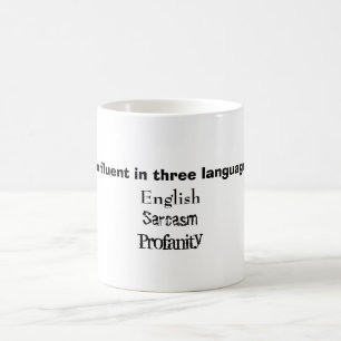 Café Fluido en taza de tres idiomas