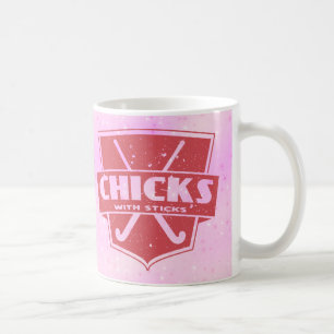 Café Polluelos del hockey hierba con la taza de los
