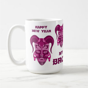 Café Taza con arte de máscara tradicional