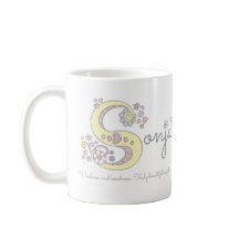Taza conocida del monograma del significado de la