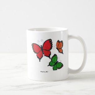 Café Taza del rojo, anaranjada y verde de las mariposas
