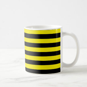 Café Taza negra y amarilla de las rayas