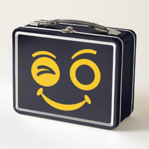 Caja de comida metálica con cara sonriente guiñand