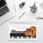 Caja Para Tarjetas De Visita Profesor de Música de Guitarra Acústica Piano Keys<br><div class="desc">Parecer más profesional y mantener sus tarjetas de visita en un estado impecable al mismo tiempo con este elegante funda de tarjetas de negocios moderno en blanco y negro, con guitarra y teclas de piano para aquellos cuya pasión o profesión es la música. Ideal para profesores de música, músicos o...</div>