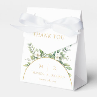 Cajas blancas de regalos de boda con monograma bot