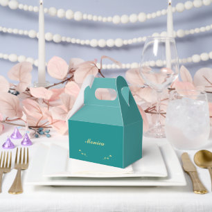 Cajas de favores verde azuladas y de oro para la d