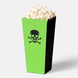 Cajas de palomitas de maíz verdes del cráneo negro