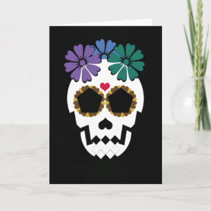 Calavera con tarjeta de saludo de flores