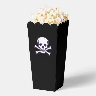 Calavera en cajas de palomitas negras de huesos