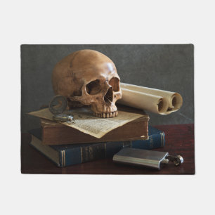 Calavera en la alfombra de la puerta de los Libros