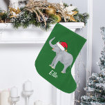 Calcetín Navideño Grande Elefante de Navidades Cute<br><div class="desc">Este hermoso elefante Navidad presenta un hermoso elefante sonriente con un sombrero rojo de Santa con un baúl elevado. Este bonito de Navidades de animales personalizados está decorado con un bonito fondo de vacaciones verde. Personalice con su propio texto en la parte inferior para un regalo elegante.</div>