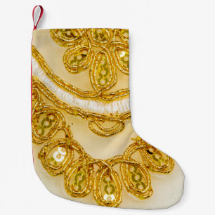 Calcetín Navideño Pequeño Banda dorada de encaje amarillo. Textura de fondo,