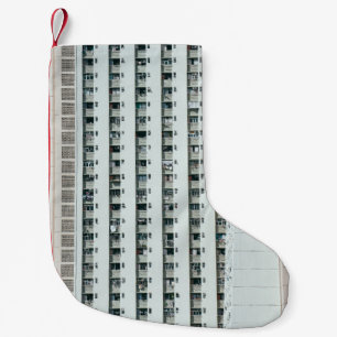 CALCETÍN NAVIDEÑO PEQUEÑO EDIFICIO DE CONCRETO BLANCO Y AZUL