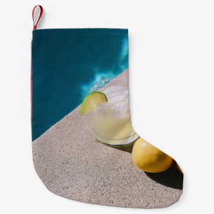 Calcetín Navideño Pequeño Frutos redondos amarillos sobre mesa gris