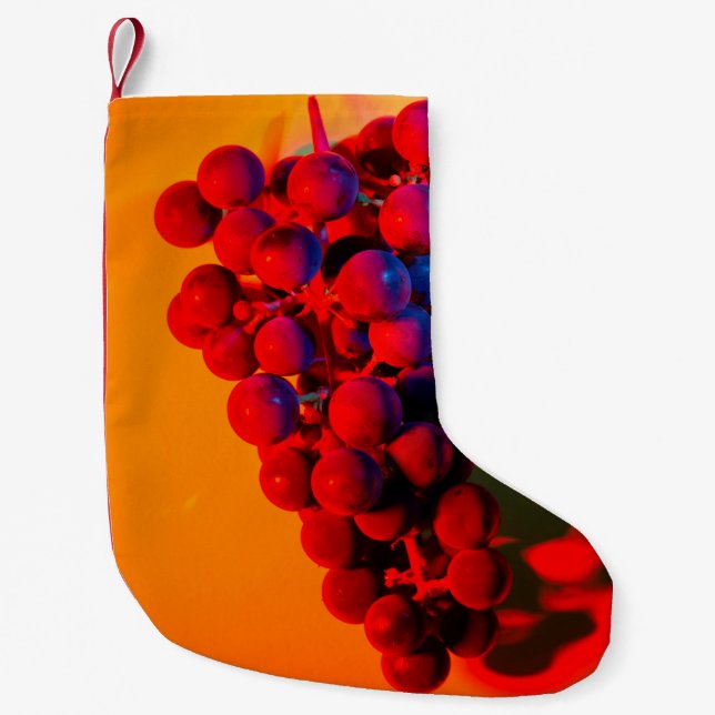 Calcetín Navideño Pequeño Grupo de uva azul en luz de neón naranja. Alimento (Anverso)