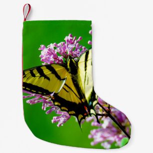 CALCETÍN NAVIDEÑO PEQUEÑO MARIPOSA AMARILLA SOBRE FLORES ROJOS